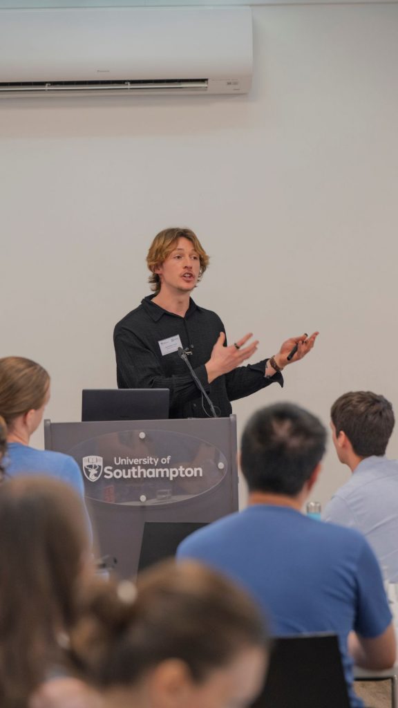 Jack Hilton Jones presenting to audience at MINDS CDT showcase