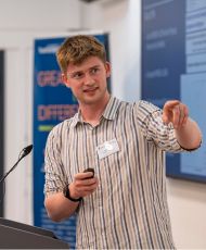 Jack Dymond presenting at the 2026 MINDS & SustAI CDT Showcase.