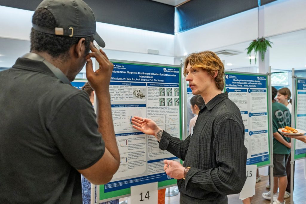 Jack Hilton Jones showcasing his poster at MINDS CDT showcase event